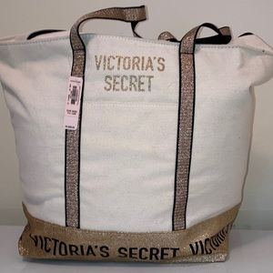 Victoria’s Secret NWT weekend bag. Canvas with gold sparkle and black trim